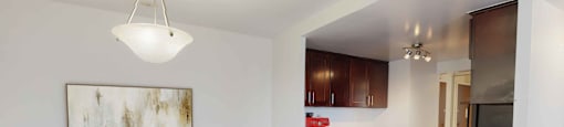 a kitchen and dining area in a 555 waverly unit