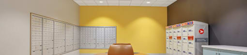A waiting room with a bench and a wall of lockers.