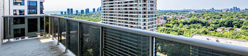 A balcony with a view of a cityscape.