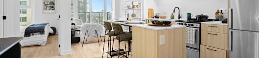 A modern kitchen with wooden cabinets and stainless steel appliances.