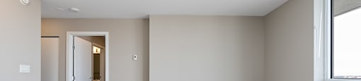 A room with a doorway leading to another room.