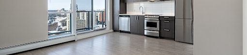 A modern kitchen with a view of the city.