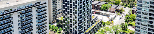 A cityscape with a mix of residential and commercial buildings.