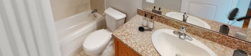 Washroom with bath, toilet and sink