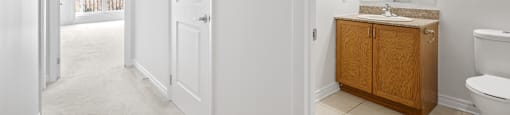 A bathroom with a toilet, sink, and medicine cabinet.