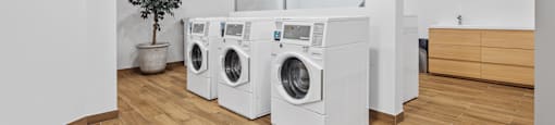 A laundry room with a washer and dryer in it.