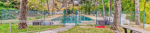 a park with a pool and a picnic table