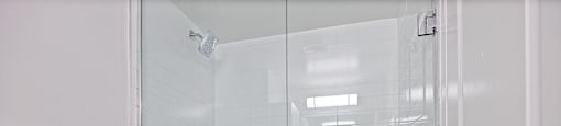 A shower with a glass door at 50 Prince Arthur