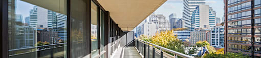 a view of the city from the balcony of a building on a balcony walkway