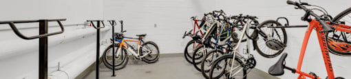 A bike rack with several bikes on it.