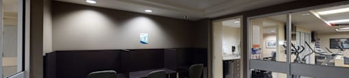 a conference room with a table and chairs