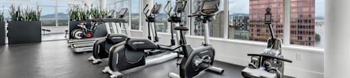 A gym with a view of the city.