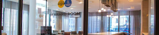 A glass door with a sign that says Gerrard Room.