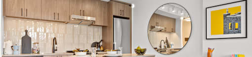 a kitchen with a breakfast bar and stools