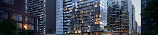 A modern glass skyscraper stands tall among other buildings in a cityscape.