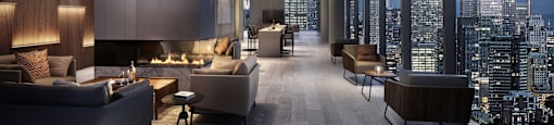 A modern living room with a view of the city skyline.