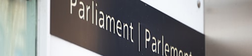 a sign on the side of a building that reads parliament parliament