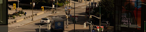a busy city street with buses and cars on it