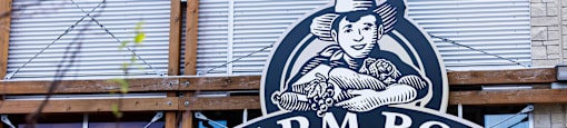 a farm boy sign on the side of a building