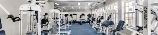 Gym with cardio equipment and a large window at Timber Lakes at Red Bridge, Missouri 