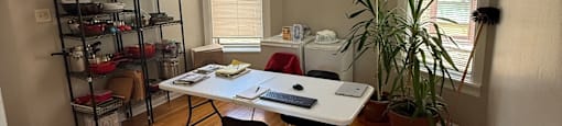 A room with a desk and a chair.