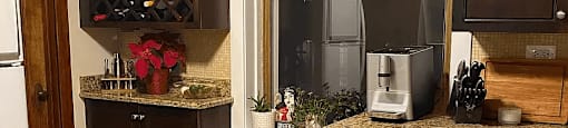 a kitchen with wooden floors and a window