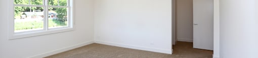 A room with a window and a door.