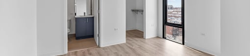 A room with a wooden floor and white walls.