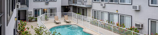 a view of the pool and pool house from the balcony