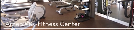A fitness center with a variety of equipment.