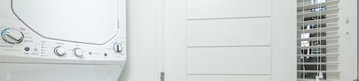 a white washer and dryer in a laundry room
