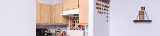 a view of a kitchen from a window in a living room