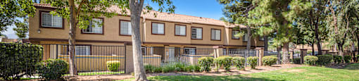 our apartments offer a spacious courtyard with green grass and trees