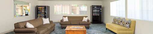 a living room with couches and a coffee table