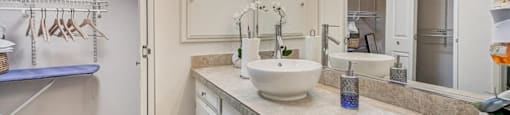 a bathroom with a sink and a mirror