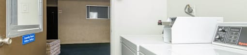 a room with a washer and dryer in it