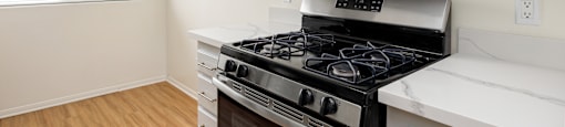 the preserve at ballantyne commons apartment kitchen with stove and microwave