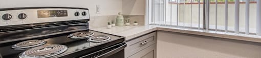 a kitchen with a stove and a microwave