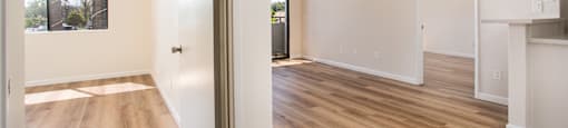 A room with wooden floors and white walls.