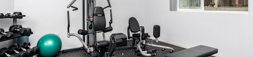 a gym with weights and other exercise equipment