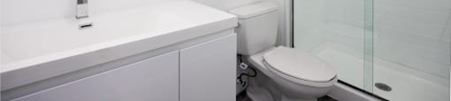 a bathroom with a sink toilet and a shower