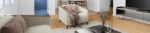 a living room with a couch and a table and a television