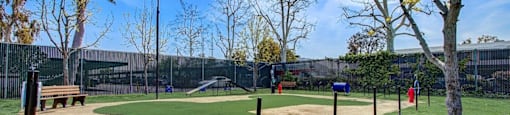 a park with a baseball field and a playground