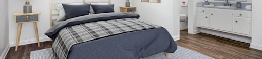 a bedroom with a bed and a bathroom