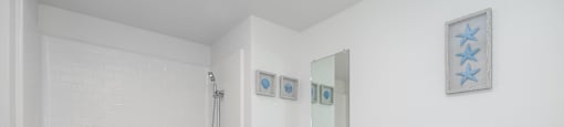 A white bathroom with a toilet, a sink, and a bathtub.