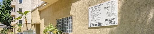 A pool with a warning sign on the wall.