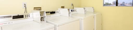 a washer and dryer are available in the laundry room