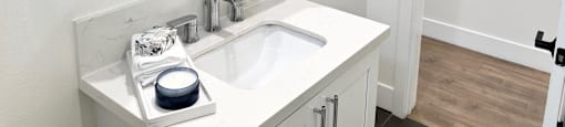 a bathroom with a sink and a mirror