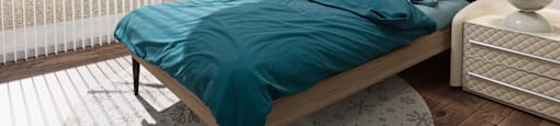 a bedroom with a bed and two windows