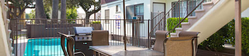 our apartments have a large back yard with a grill and bbq